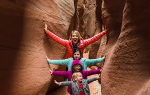 Family exploring slot canyon in Kanab, Utah – kid-friendly hiking adventure